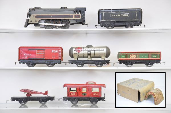 Boxed Marx Set 3963: 391 style gray locomotive, NYC tender, 552 gondola, B&LE boxcar, flat with airplane (plane shows heavy wear) 553 tank car, 556 caboose, fiber tunnel, track and transformer, set box with all inserts. S