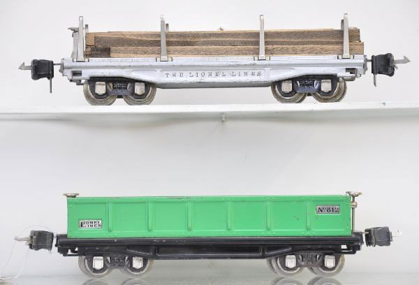 Lionel 811 & 812 Freight Cars: 811 lumber car, fairly clean with nice lettering, replaced load; 812 gondola, shiny. Both have manual box couplers and show light to moderate to playwear, C7-7+