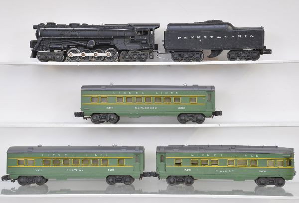 Lionel Steam Passenger Set: 681 steam turbine, cab lettering off one side; 2671W Pennsylvania tender; 2400 Maplewood Pullman, upper corner chips on both ends; 2402 Chatham Pullman; 2401 Hillside observation. Two Pullman roofs ar