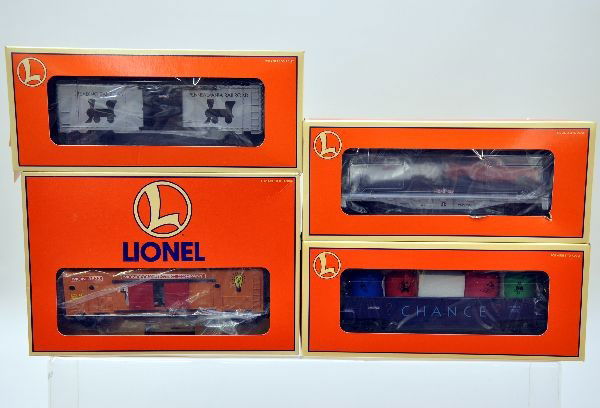 Boxed Lionel Monopoly Cars: 52185 chance gondola, 52184 free parking flat car, 52182 railroads boxcar, 3533 generator car. All have original boxes with inserts, C9