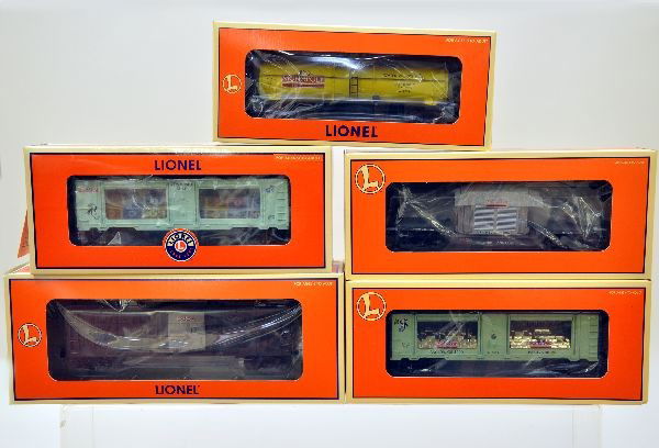 Boxed Lionel Monopoly Cars: 52158 tax car, 52159 electric company car, 52160 water works car, 52183 jail car, 29624 mint car. All have original boxes with inserts, C9