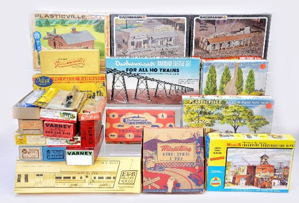 Large Group of Boxed HO Pieces: This lot includes several car kits by Ideal, E&B, Varney, Athearn and others. Plus accessories and figures by Bachmann, Authenticast, Minatoy and others. Kits appear complete but are not guaranteed. A