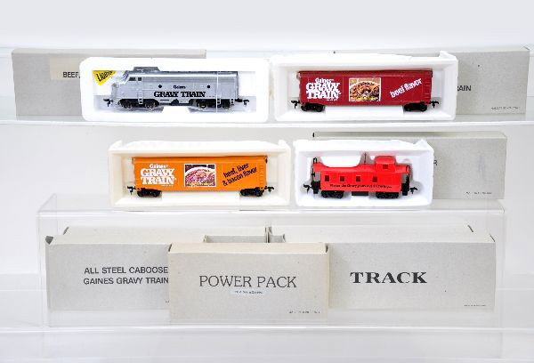 Scarce Early HO Promo Set: For Gaines Gravy Train, includes F9 diesel and 5 custom painted freight cars, track, transformer. All by Bachmann. Unused, in original boxes with set box, C9