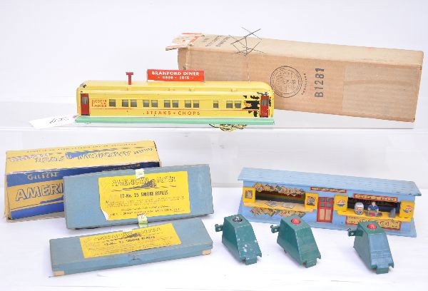 American Flyer Accessories: S-Gauge 767 Branford Diner complete, painted version, paint flaking 15%, has clean original box; 2 of 6 #25 smoke refill cartridges with master box; 3 bumpers; 270 News & Frank stand, missing one figu