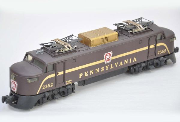 Lionel 2352 PRR EP-5: Clean with nice matte patina, one nose decal is 85%, others are 95%, minor factory touch-up on stripe one side, battery box is clean but cover and rollers show surface oxidation. Otherwise, shows ligh