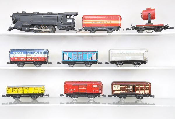 Marx Steam Freight Set: Post-war. 994 loco, red NYC tender, gondola, B&LE boxcar, stock car, hopper, searchlight (missing lens cap), SOM boxcar, 2072 NYC observation. Otherwise, all are clean and shiny showing light to moder