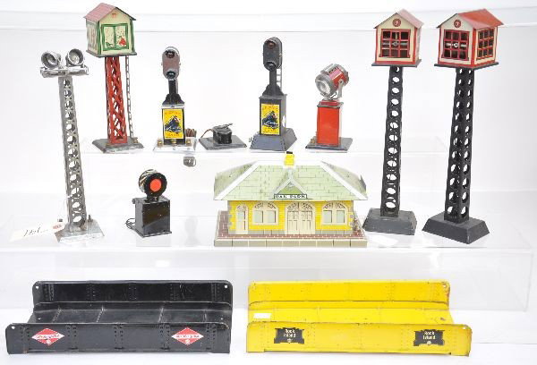 Marx Accessory Assortment: 3 control towers, flood light tower, block signal, yard light, bumper, whistling station, control block signal, 2 girder bridges, All show light to moderate playwear, C7+
