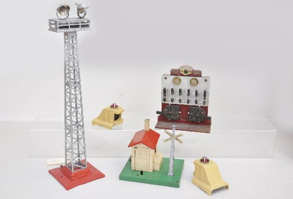 Lionel Accessories: Pre-War. 2 #25 bumpers; 92 flood light tower. All three are professionally restored. 439 panel board, light rust on base corner and dirty; 45N gateman. Otherwise, shows moderate to heavy playwear, C5-