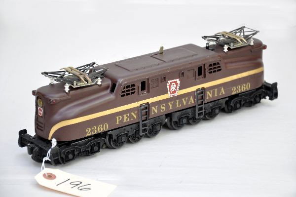 Lionel 2360 PR GG1: Last version with full decals, one nose decal is 90% otherwise, decals are 98%. Nice matte patina to tuscan paint, very minor chips on lower edge. Shows very light playwear, C7+