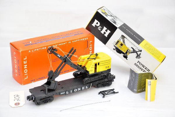 LN Boxed Lionel 6827 P&H Shovel: Flat is test run, shovel is intact with instructions, inner box is clean with original pamphlet, missing cotton wrap, early perforated window box. Set is like new, C8+