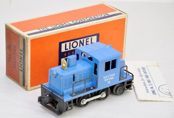 Boxed Lionel 51 Navy Switcher: Clean with intact struts, hairline screw crack one side, instruction sheet, original box with insert, one flap is dark. Test run, like new, C8-9