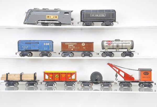 Pre-War Marx Steam Freight Set: Gray Commodore Vanderbilt loco, tender, high gondola, tank car, B&LE boxcar, unusual with solid doors, lumber flat, hopper, cable reel flat missing roper and wrecker. All have 8 wheel trucks. Shows li