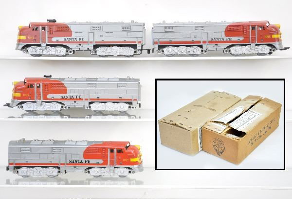 Boxed Marx Santa Fe Diesels: 2 sets of 1095 Santa Fe E8 diesels, missing 6 horns, all steps intact, original master cartons with several inserts, one has flap issues, one has Montgomery Ward label. Locos show light playwear, C7+