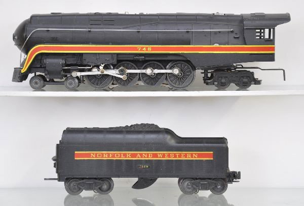 Lionel 746 N&W J Locomotive: Clean with nice stripes, original nose paint and insert, 746W short stripe tender with heat stamped lettering. Shows light to moderate playwear, C7