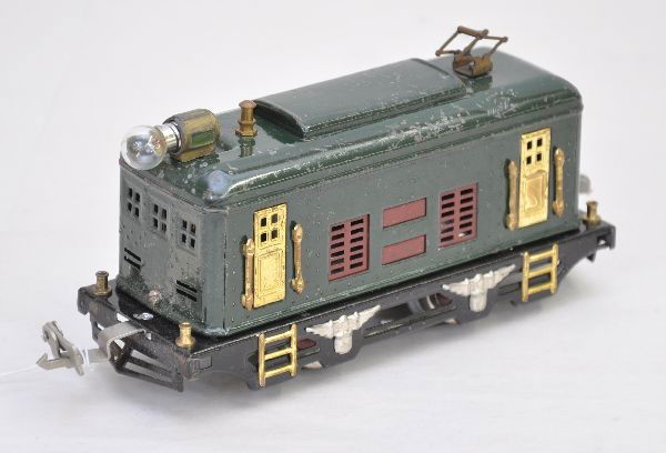 Scarce Lionel 248 Locomotive: Pre-War. Scarce dark green color with maroon trim, lettering light but readable, rewheeled and new couplers. Clean and shiny showing moderate playwear, C6