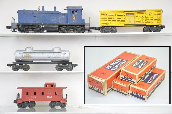 Boxed Lionel Diesel Freight Set: 621 Jersey Central NW2 Switcher, with screw crack, decals 85%; 6656 stock car with Armour decal; 6465 tank; 6257 caboose. All have original boxes, trains show moderate playwear, C6+