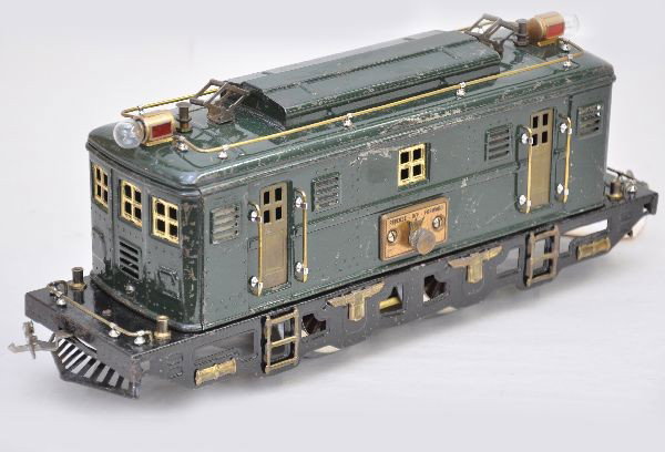 Scarce Lionel 9U Locomotive: Standard Gauge. Scarce dark green box cab electric, rewheeled with headlights and handrails. Shows moderate to heavy playwear but clean and shiny, C5