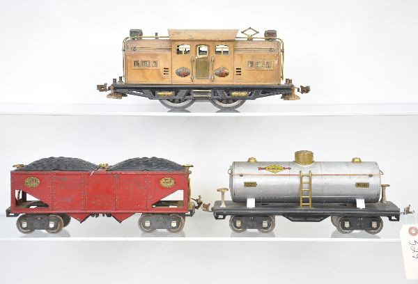 Lionel Train Set: Standard Gauge, Pre-War. 318E Baby State Loco, bus bar version with brown pilots, body is stained; 516 coal train hopper, one broken coupler; 515 Sunoco tank car. Otherwise, all show moderate to heavy