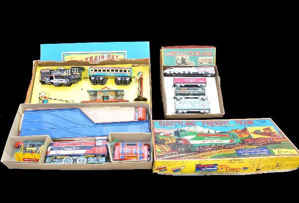 Boxed Tin Toy Train Sets: San Japan, American Flyer Lines 4 pc. set with insert; Cragstan Shuttling Freight Train battery set, battery box is clean; Yone new train set with display insert. All show very light playwear, origina