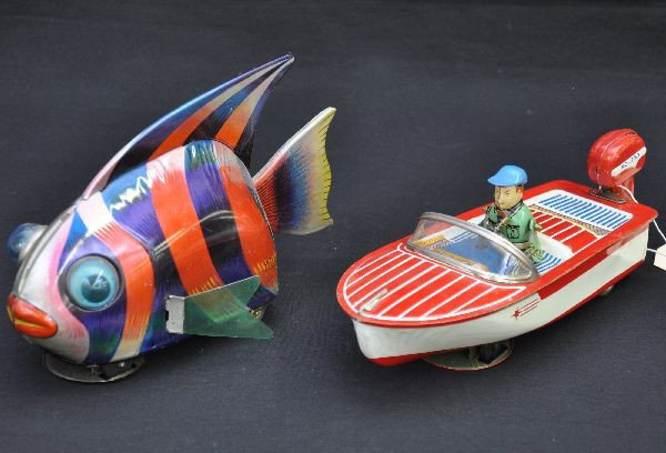 Unusual Gyro Powered Friction Toys: Both have crank action gyro mechanisms with mystery action and function wonderfully. 8" power boat and 7" fish marked KD Japan. Small split on one fin but doesn't detract. Otherwise, both are clean an