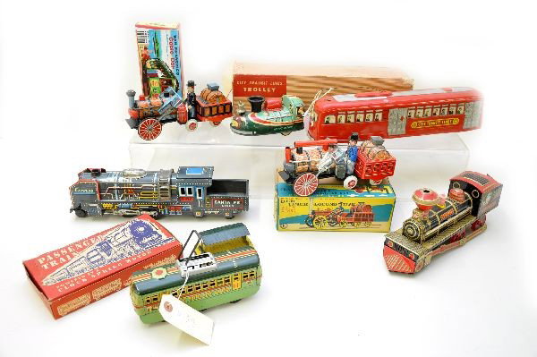 Nice Group of Toy Trains: Largest is 14". Includes CTL electric trolley, friction, with rough ob; Santa Fe Express friction train; 2 different K Japan Old Timer Locos, one has ob; MT Japan City Trolley, lever action, functiona