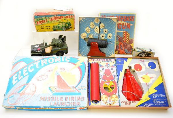 Boxed Military Toy Lot: K Japan 7" rocket launcher Jeep with missile; General Toy coastal defense gun set, missing 3 bullets; Animate US Baby Tank with display box and instructions; The Electric Game Company, electronic miss