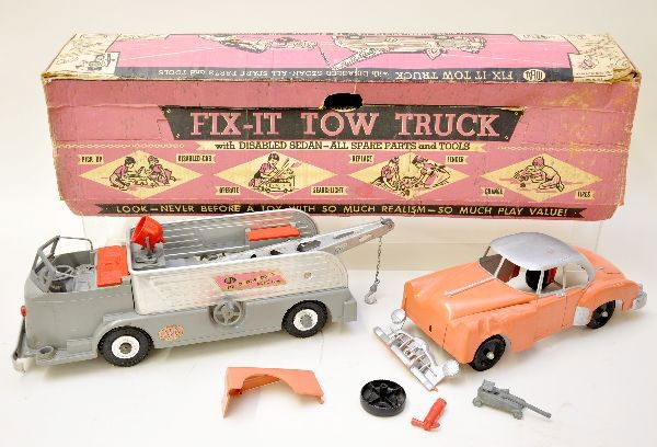 Ideal 3001 Fix-It Tow Truck: Includes 20" plastic and tin wrecker, appears complete with fire extinguisher, jack and searchlight. Searchlight is missing lens and insert. Vehicle included has replacement grill and fender, set has