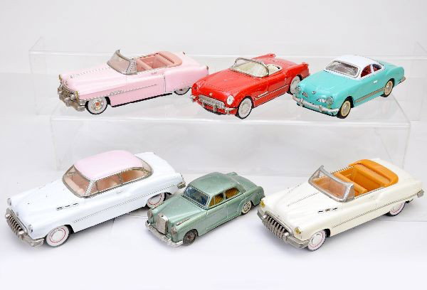 Japanese Tin Cars: Bandai, 7 1/2" Mercedes 2/9 missing hubcap and hood ornament; 10" VW Karman Ghia; Corvette, missing headlight lens; Cadillac and 2 Buicks, one missing hood center trim. All show light to moderate play