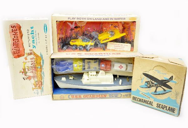 Boxed 1960's Toys: Ideal mechanical sea plane, plastic, mechanism functional; Remco 451 Flintstones motorized yacht kit, appears like-new; Remco 650 Voyage to the Bottom of the Sea, sub scout set, new in display box; La