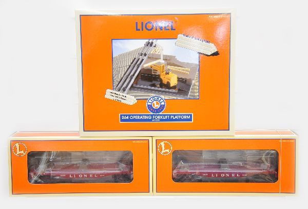 Lionel 14000 Fork Lift Platform & Cars: This is the nice re-issue of Lionel's post-war 264 fork lift platform. It includes 2 #19484 lumber cars. All are unused with original boxes, C9-10