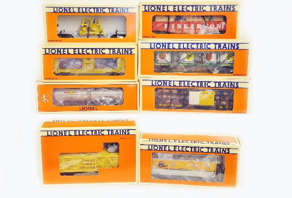 Boxed Lionel Freight Cars: 19940 vat car, 17617 caboose, 19822 pork dispatch, 16683 elephant car, 16150 tank car, 16681 aquarium, 16674 cop and hobo, 16935 flat with dozer. All are unrun with original boxes and inserts, C9