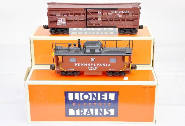 Boxed Lionel Scale Freight Cars: 51402 C&O stock car, 51702 PRR N-8 smoke caboose. Unrun, original boxes with inserts, C9