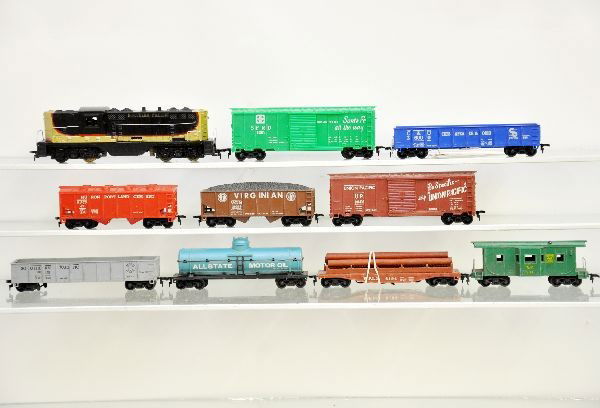 Marx Diesel Freight Set: NP GP-3 diesel, cab has chip near clip on side; Allstate tank; SF boxcar; Virginian hopper; UP boxcar; cement car; SP gondola; WFLX log dump; C&O gondola; WP bay window caboose. Otherwise, shows light