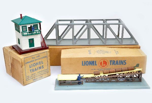 Boxed Lionel Accessories: 317 gray trestle bridge; 362 barrel loader, blue figure version with load and controller; 445 operating switch tower. All have ob's and show light to moderate playwear, C7-7+