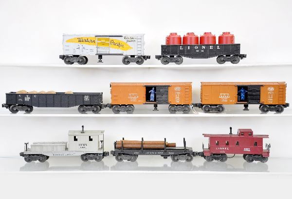 Lionel Freight Cars: 3474 WP operating boxcar, strong decals; 6112 gondola with canisters; 6462 gondola with drums; 2 #3464 NYC operating boxcars; 3461 lumber dump; 6419 work caboose; 6357 caboose. All show light to moder