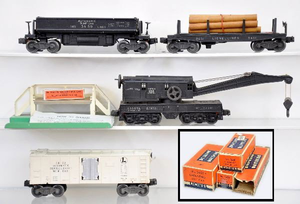 Boxed Lionel Early Freight Cars: 3459 coal dump with partial 207 and instructions; 3451 lumber dump; 3462 milk car with platform, instructions and -70 box; 2460 crane with rough ob. Otherwise, all show light to moderate playwear and 