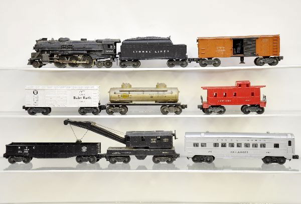 Lionel Post-War Lot: 2036 steam loco, one broken step; 6466T tender, 6465 tank car, missing coupler; 6014 boxcar, 3464 NYC operating boxcar, 6460 crane, 6462 gondola, 6017 caboose with broken roof; 2421 Maplewood Pullman.