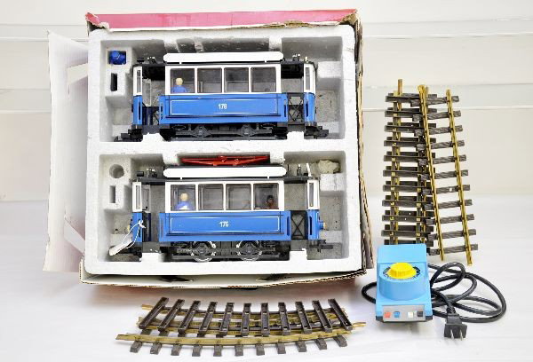 LGB G-Gauge Trolley Set: Includes powered and trail car with some figures, original set box bottom with insert. Also includes a circle of track and transformer. Trains show light to moderate playwear, C7+
