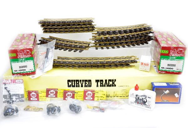 G-Gauge Track & Accessory Lot: Aristo Craft 11800 12 sections extra wide curve; LGB 1000 straights, 8 pcs with ob; also includes a large selection of parts, pieces, couplers and wheels, many mint on card. Plus, a selection of curve