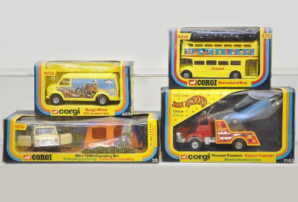 Boxed Corgi Vehicles: 38 Mini 1000 camping set, figures sealed, 470 Disneyland bus, 1163 Jean Richard human canon circus, 423 Rough Rider van. All have original boxes with display inserts, circus truck window box has a hol