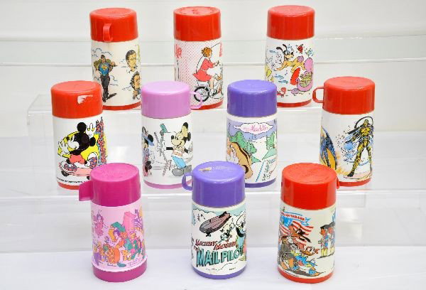 Large Group of Original Thermoses: Lot includes: Disney America on Parade, 1983 Superman III, 1987 Captain Power, Disney Under Water, 1981 Annie, Mickey, Travel Mickey & Minnie, Mickey Mouse Mail Pilot, 1971 Bugaloos, Aladdin. All are 