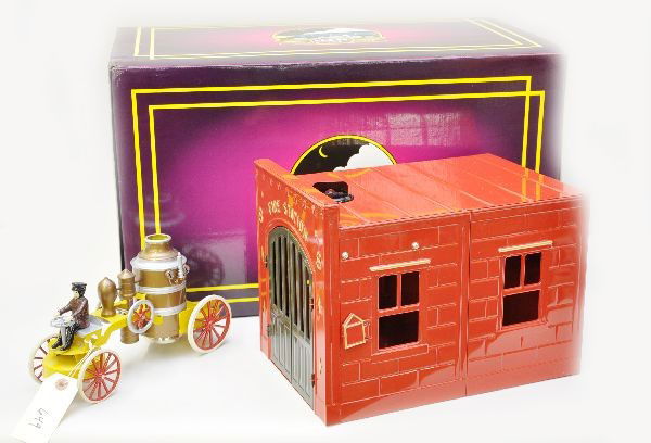 Boxed MTH Kingsbury Fire House: Nice reissue of this classic toy. Painted pressed steel. Includes bell ringing pumper and operating fire station. Both are unused in original box with inserts and shipper, C9-10