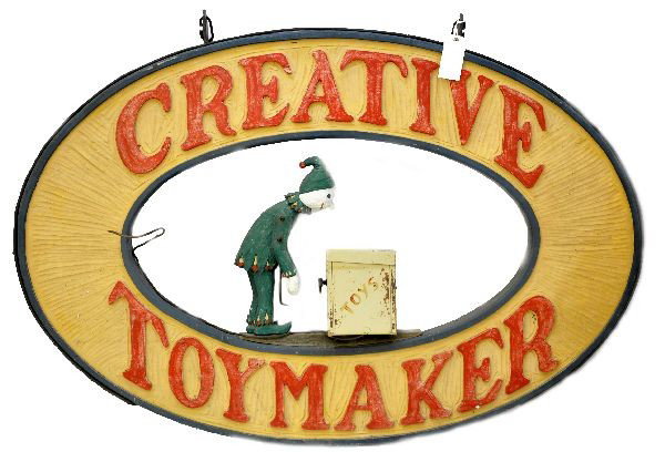 Original Folk Art Toy Store Sign: 48" X 32" hand carved wooden sign with a metal hanging ring. This charming sign hung in front of the Creative Toymaker Store since its inception in the 1960s. It is fairly clean with a three dimension