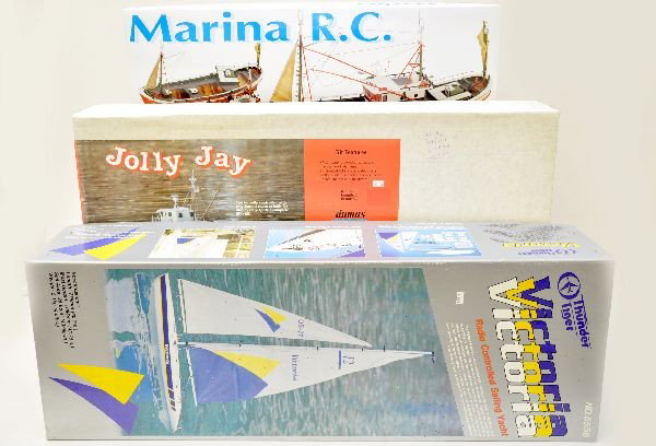 Boxed Large Wooden RC Boat Kits: Artesania, #20605 Marina 1:35 scale; Dumas, Jolly Jay Fishing Boat, 24" long; Thunder Tiger Model Co., Victoria sailboat, 30" long. All appear complete and unused in original boxes. All are RC compati