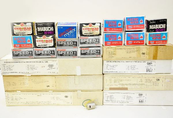 Large Group of RC Boat Equipment: This lot contains many new and packaged parts for RC boats including many Dumas boxed equipment, motors, gears, props and other mechanical parts. Almost fills a 12" x 12" x 24" box. Most appear new in
