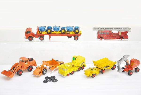 7 Matchbox King Size Vehicles: Includes K15 Fire Engine, missing one tire, #K3 shovel, #K2 dump truck, #K12 mobile crane, #K6 scraper, #K20 tractor transporter, K1 mobile crane (missing one tire). All are dirty but show light playw