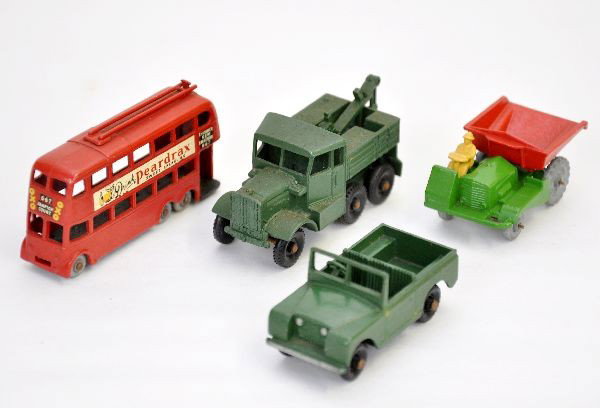 4 Early Matchbox Vehicles: Metal wheels include #56 trolleybus decals 96%, #2 tipper dump. Black plastic wheels include #64 break-down truck, #12 Land Rover. All have axle oxidation and should otherwise clean to C8
