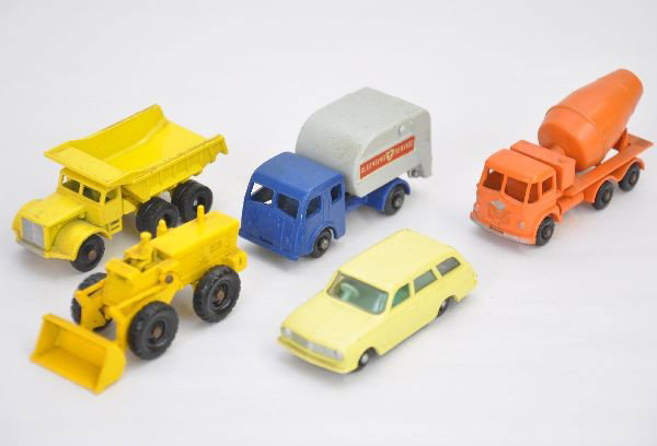 5 Matchbox Vehicles: All black plastic wheels. Includes #38 Estate car, #6 dump truck, #43 tractor shovel, #26 cement truck, #15 garbage truck. All are a bit dirty and have light axle oxidation but should clean to C8