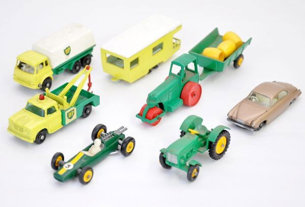 8 Matchbox Vehicles: All black plastic wheels. Includes #50 tractor, #51 tipping trailer with barrels, #19 Lotus, #28 Jaguar, #23 Caravan trailer, #13 wrecker, #1 road roller, #25 BP truck. All are a bit dirty but show li