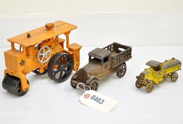 3 Cast Iron Vehicles: Hubley Huber Road Roller, 8" long, over painted; Arcade 7" stake truck, no paint; Arcade 5" gasoline truck, C2. All for restoration